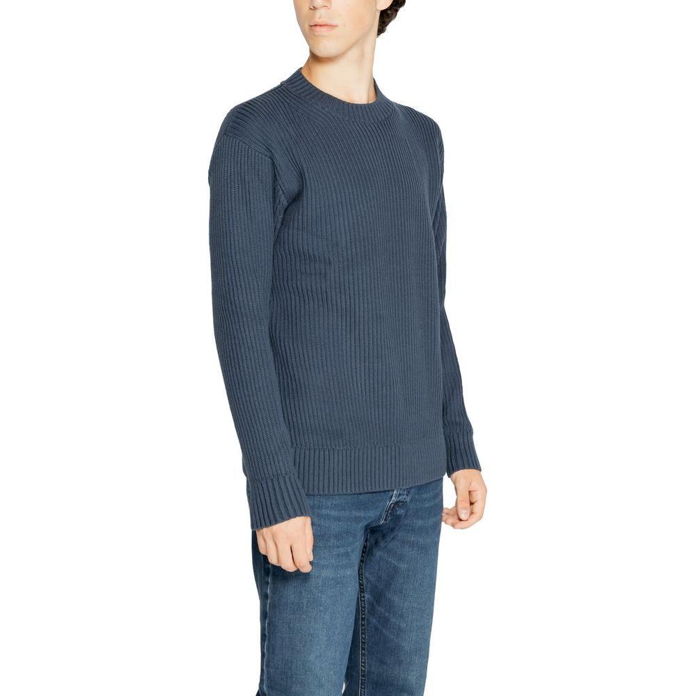 Calvin Klein Jeans Black Organic Cotton Sweatshirt with vertical ribbed knit design for a modern look, shown on a model wearing jeans.