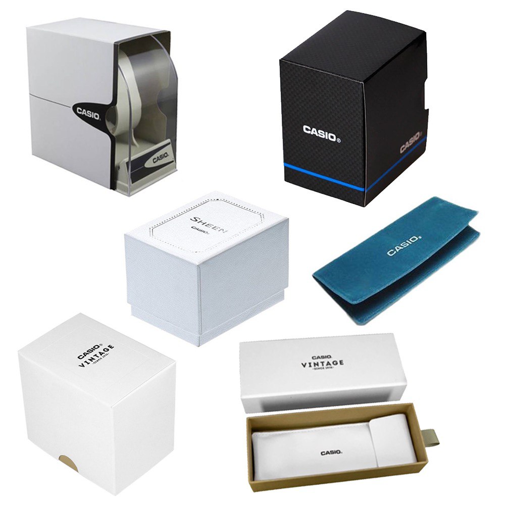 Collection of CASIO watch packaging boxes including vintage and modern designs, showcasing the brand's attention to detail in packaging.