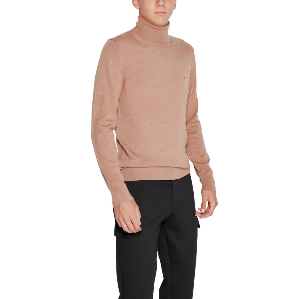 Man wearing Calvin Klein Beige Wool Turtleneck sweater in elegant setting