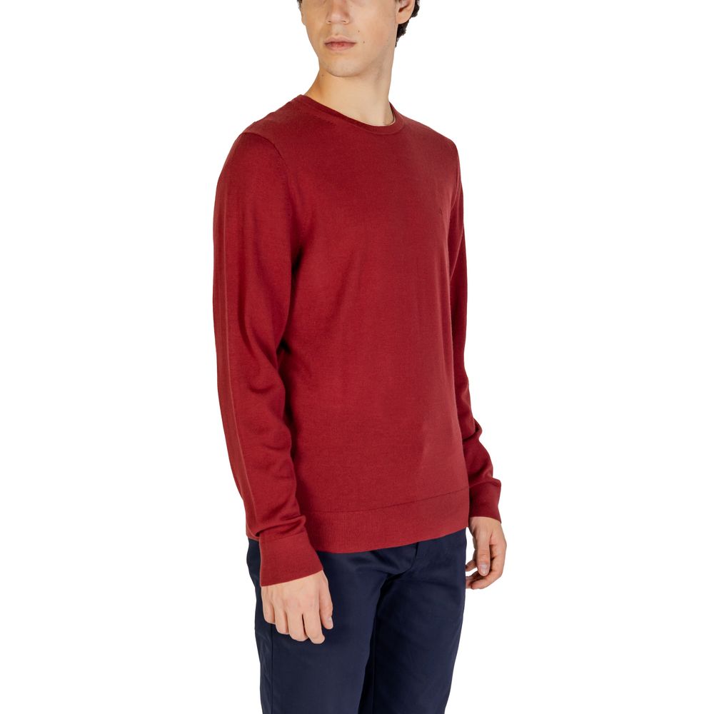 Calvin Klein Bordeaux Recycled Wool Sweatshirt on male model, highlighting crew neck design and sustainable fabric.