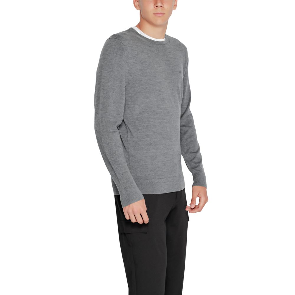 Model wearing Calvin Klein Gray Recycled Wool Sweatshirt with crew neck and ribbed finishes.