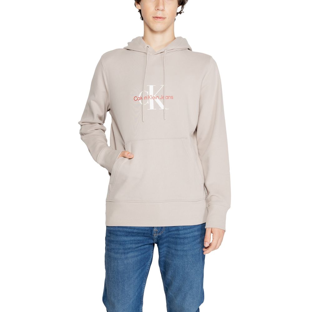 Calvin Klein Jeans Beige Recycled Cotton Hoodie with logo, model wearing with jeans, ideal for casual wear and cooler days.