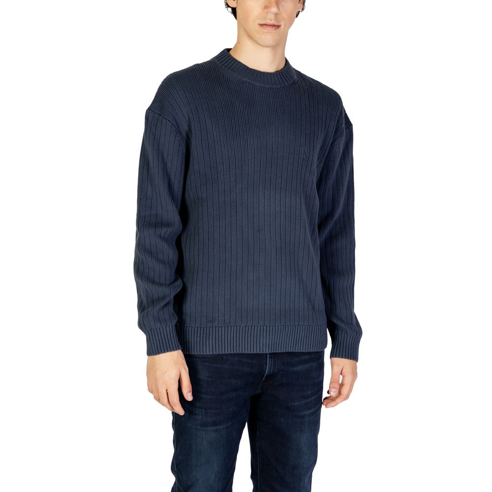 Calvin Klein Jeans Blue Cotton Sweatshirt with ribbed texture and crew neck, worn by model, ideal for transitional weather.