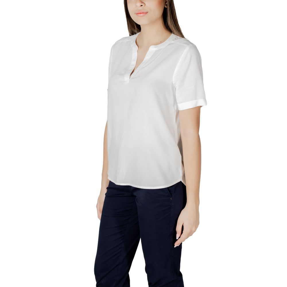 Street One White Viscose Blouse with short sleeves and a V-neckline, ideal for casual summer outfits, paired with dark trousers.