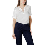 Street One White Viscose Blouse with V-neckline and rolled-up sleeves, perfect for casual summer look, paired with navy trousers.