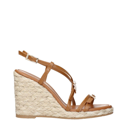 Stuart Weitzman Brown Leather Wedge Sandals with platform heel, an elegant footwear option for stylish occasions.