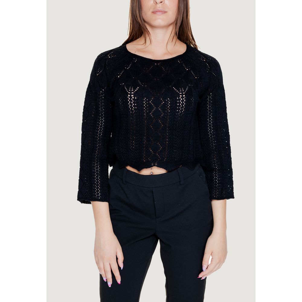 Woman wearing Vero Moda Black Cotton Sweatshirt with openwork pattern and 3/4 sleeves, showing casual elegance and style.