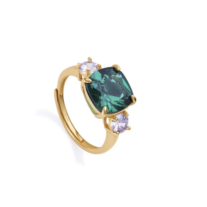 Elegant lady's ring with green gemstone and side stones, showcasing luxury jewelry design. Ideal for sophisticated styles.
