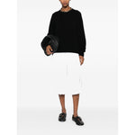 Model wearing SOFT GOAT Sweaters Black cashmere boyfriend crewneck jumper with ribbed trim crew neck and long sleeves.