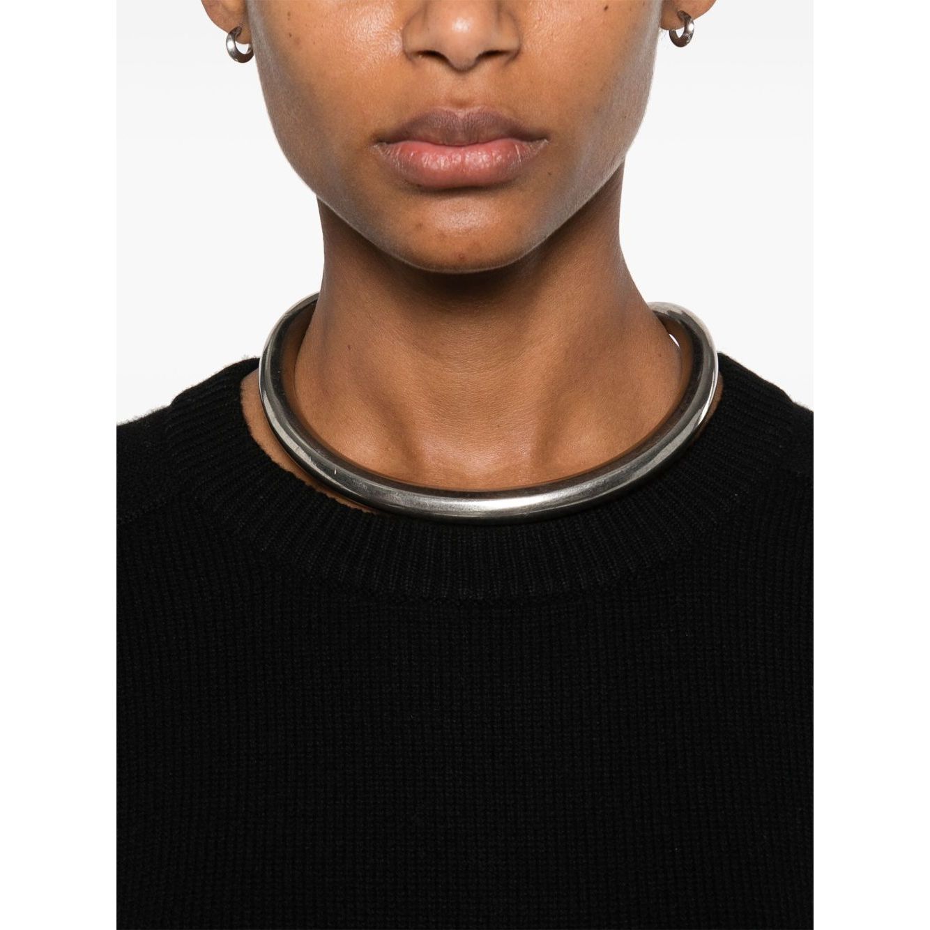 Close-up of a person wearing a SOFT GOAT Sweaters Black cashmere crewneck jumper with silver choker jewelry.