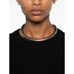 Close-up of a person wearing a SOFT GOAT Sweaters Black cashmere crewneck jumper with silver choker jewelry.