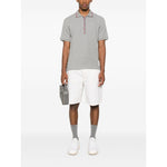 Thom Browne T-shirts and Polos Light Grey featuring a grey cotton polo shirt with button placket and short sleeves.