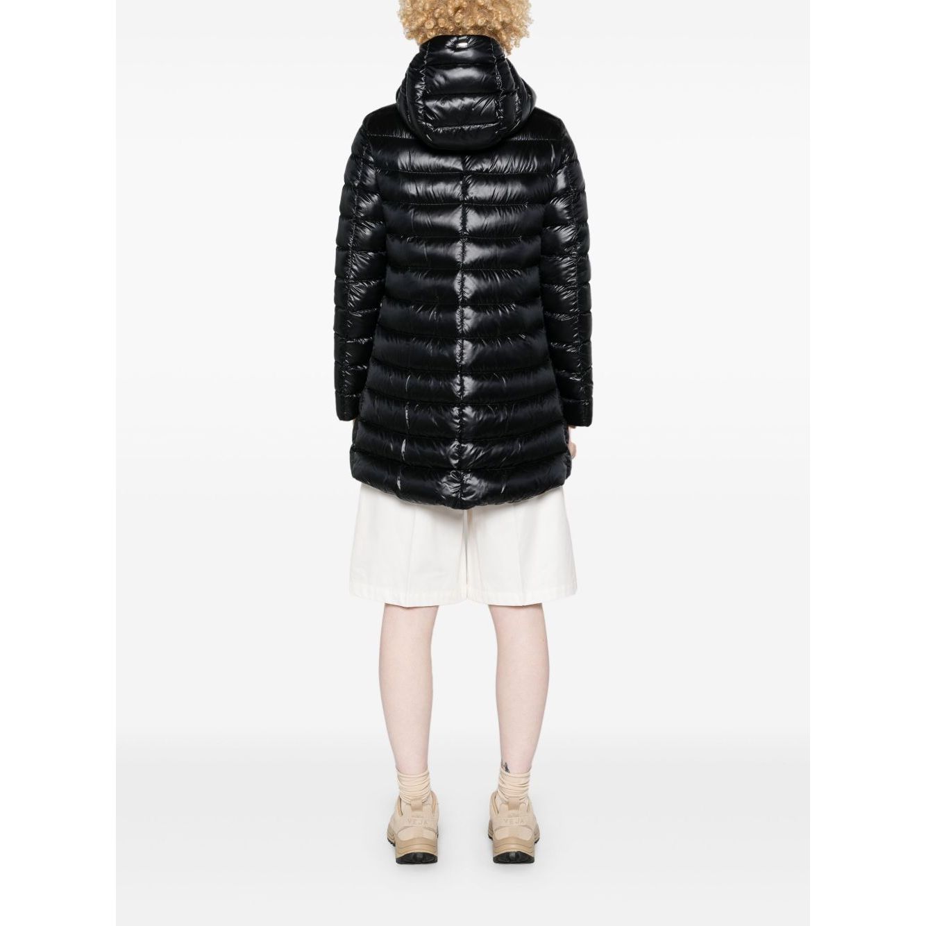 Rear view of Herno Coats Black, a feather down padded jacket with drawstring hood and curved hem.