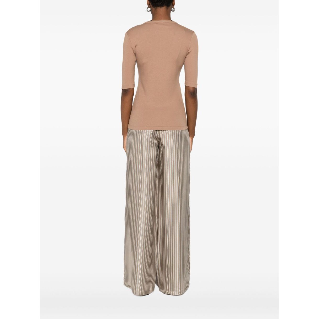 Back view of a model wearing Fabiana Filippi Sweaters Camel with light brown short sleeves and striped pants, showcasing fit and style.