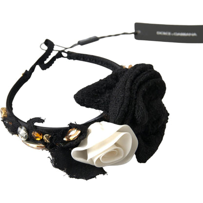 Dolce Gabbana crystal diadem headband featuring a black fabric design with a white rose and gold embellishments.