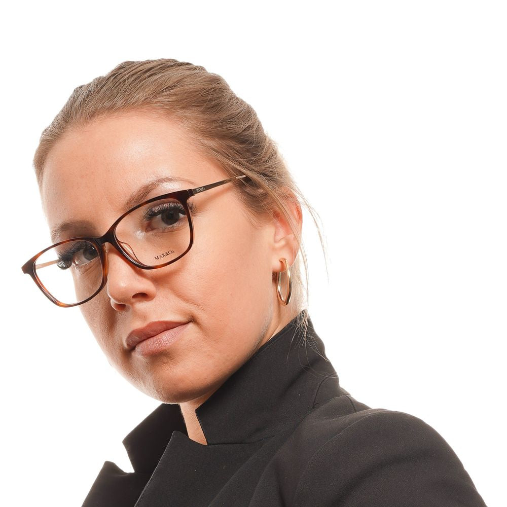 Woman wearing Max & Co Brown Women Glasses Frame in acetate with trapezium style full-rim design