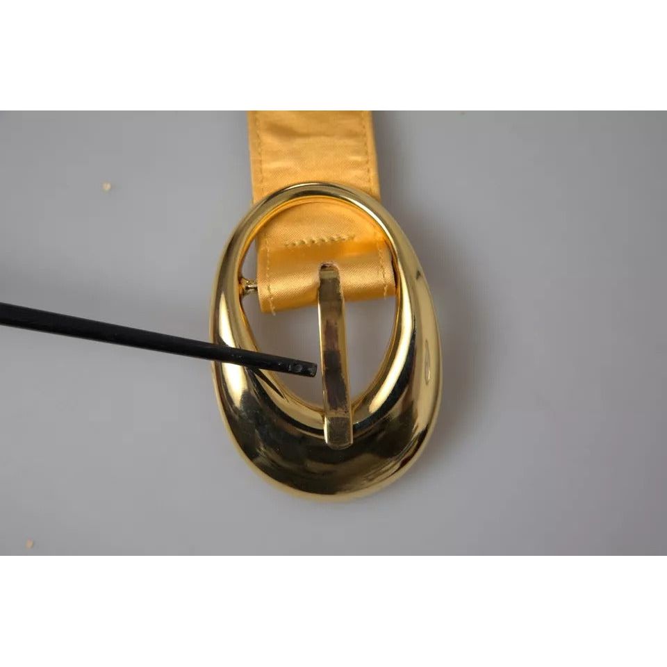 حزام دولتشي آند غابانا الذهبي المصنوع من الجلد الساتان بمشبك معدني بيضاوي