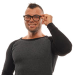 Man wearing Ermenegildo Zegna Gray Men Glasses Frame, grey sweater, smiling, adjusting glasses, isolated on white background.