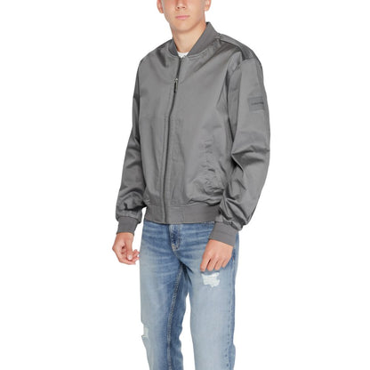 Calvin Klein Gray Organic Cotton Bomber jacket on model, showcasing modern and minimalist style.