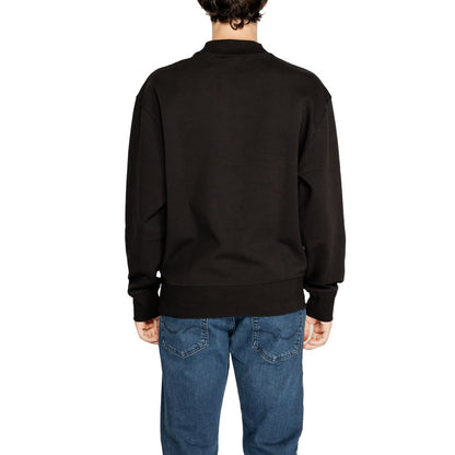 Back view of Calvin Klein Jeans Black Recycled Cotton Sweatshirt on male model wearing blue jeans.