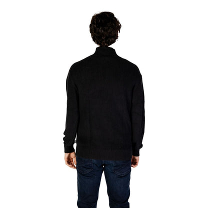 Back view of model wearing Calvin Klein Jeans Black Cotton Sweatshirt with high neckline and mixed ribbed knit
