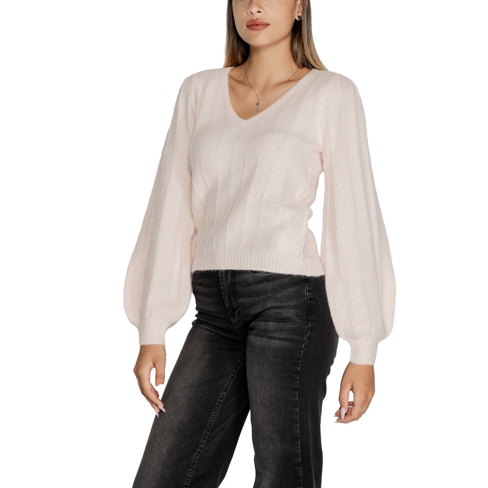 Woman wearing Guess Pink Polyester Sweatshirt with V-neckline and wide sleeves.