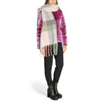 Woman wearing Only Gray Recycled Polyester Scarf with checkered design, a sustainable and stylish accessory for any outfit.