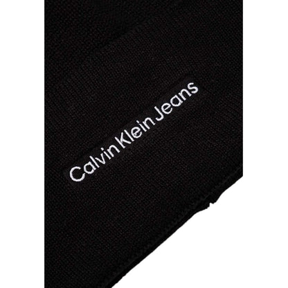 Close-up of Calvin Klein Jeans Black Cotton Cap (Baseball Hat) showing embroidered logo on black fabric.