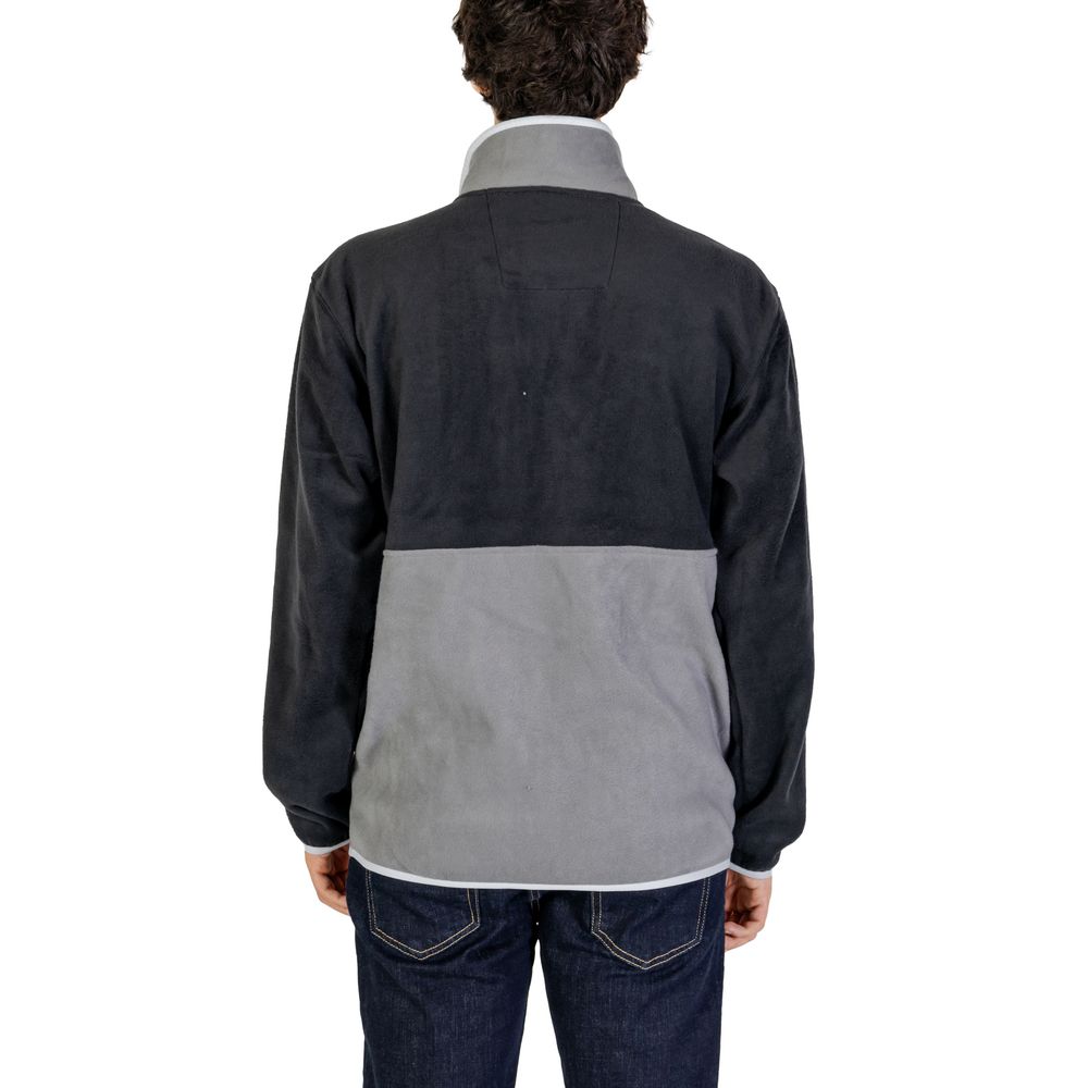 Front view with bag zipped and handles upright.