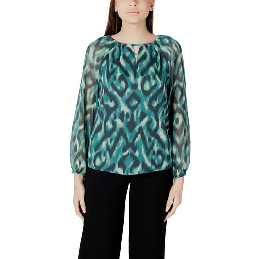 Elegant model wearing Street One Green Polyester Blouse, featuring a round neckline and long sleeves, perfect for versatile occasions.