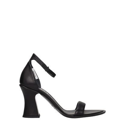 Premiata Black Leather Flat Sandals with buckle closure and high heel, featuring a vintage effect and side logo on a leather sole.