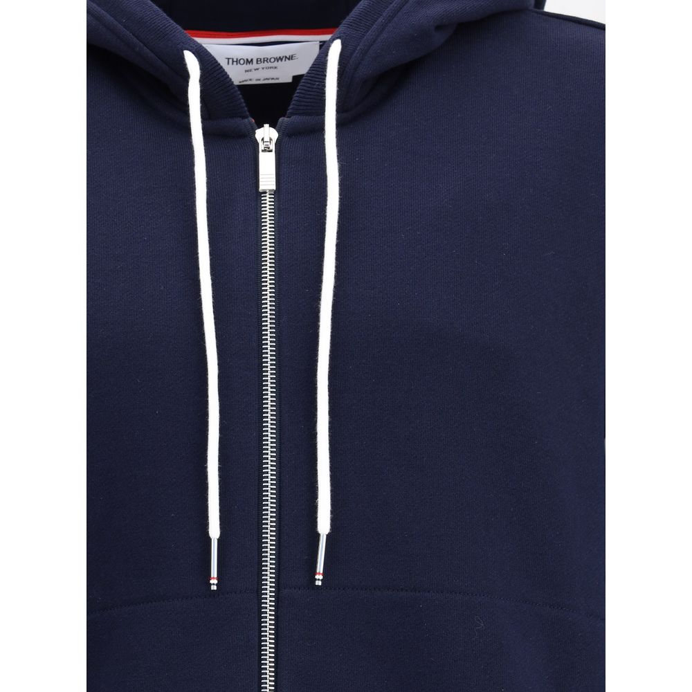 Thom Browne Blue Cotton Sweatshirt with drawstring hood and front zipper, featuring contrasting cuffs and signature patch for AW25.