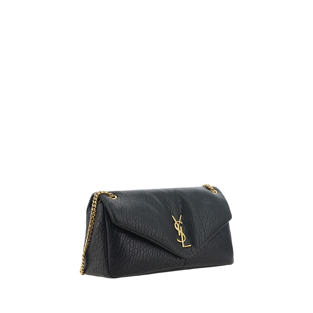 Saint Laurent Black Lamb Ovis Aries Aries Shoulder Bag with iconic YSL logo, magnetic flap, and gold chain handle.