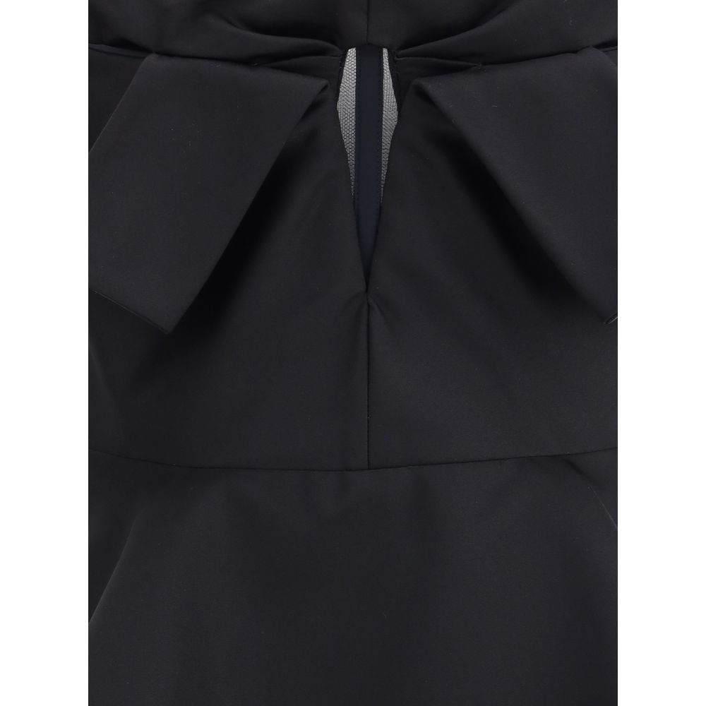 Alexander McQueen Black Polyester Top with bow detail and peplum, elegant sleeveless design, AW25 collection.
