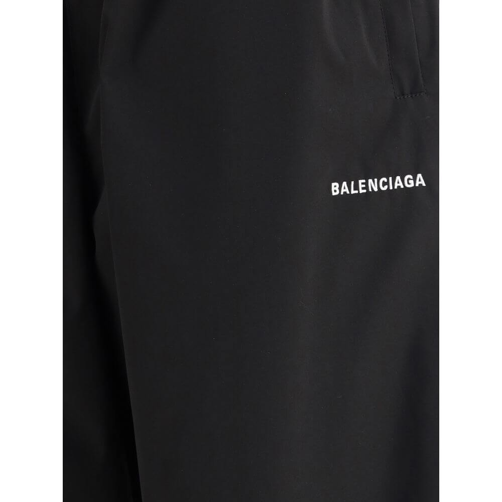 Balenciaga Black Polyester Casual Pants with logo detail and elastic waistband, featuring wide-leg silhouette and minimalist design.