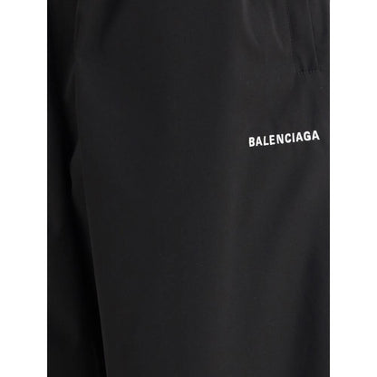 Balenciaga Black Polyester Casual Pants with logo detail and elastic waistband, featuring wide-leg silhouette and minimalist design.