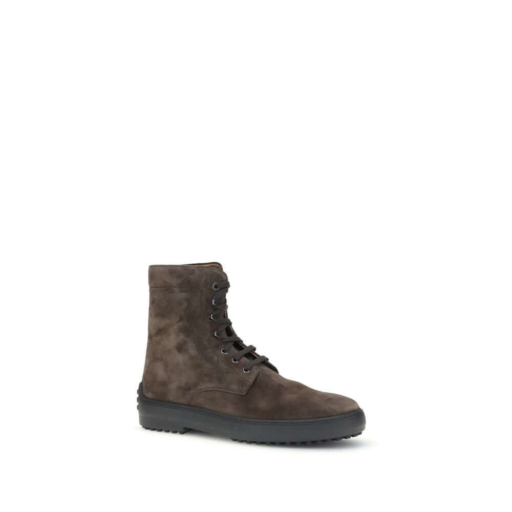 Tod's Brown Leather Lace-Up Boots with round toe, rubberized heel detail, and classic rubber lug sole. Made in Italy. Suede ankle design, AW25.