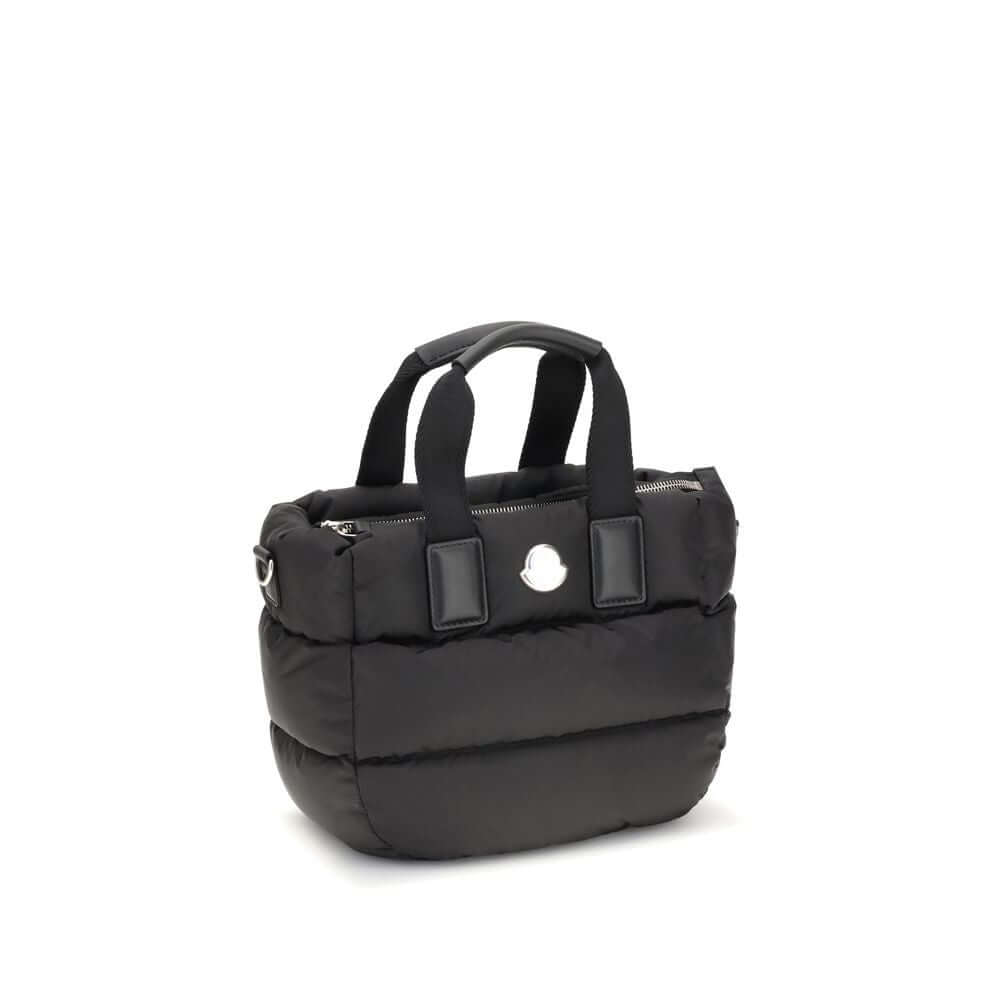 Moncler Black Polyamide Handbag with zip closure, ribbon handles, leather grips, and detachable shoulder strap.