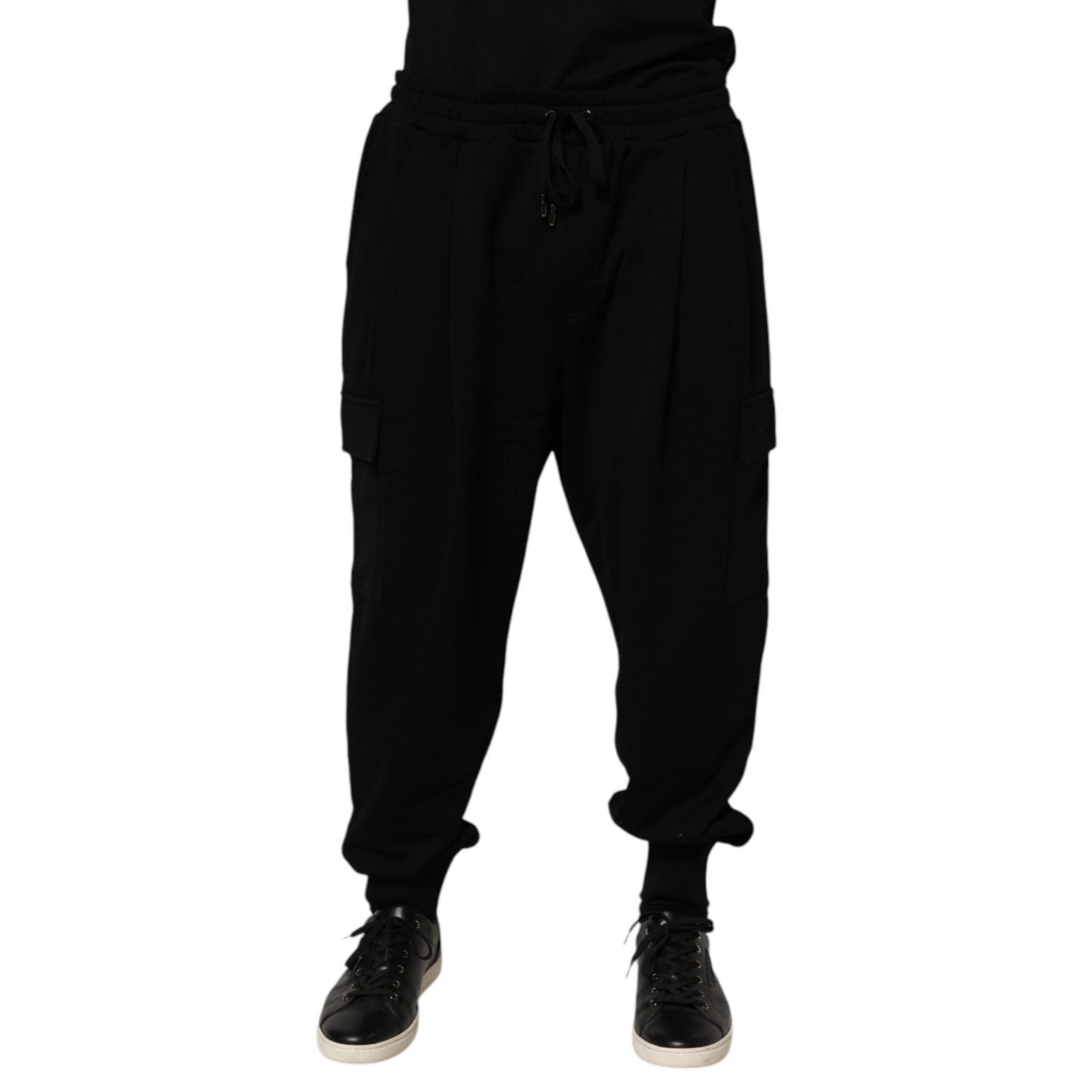 Men wearing Dolce & Gabbana Black Cotton Blend Cargo Joggers Drawstring Pants with elastic waistband and side pockets.