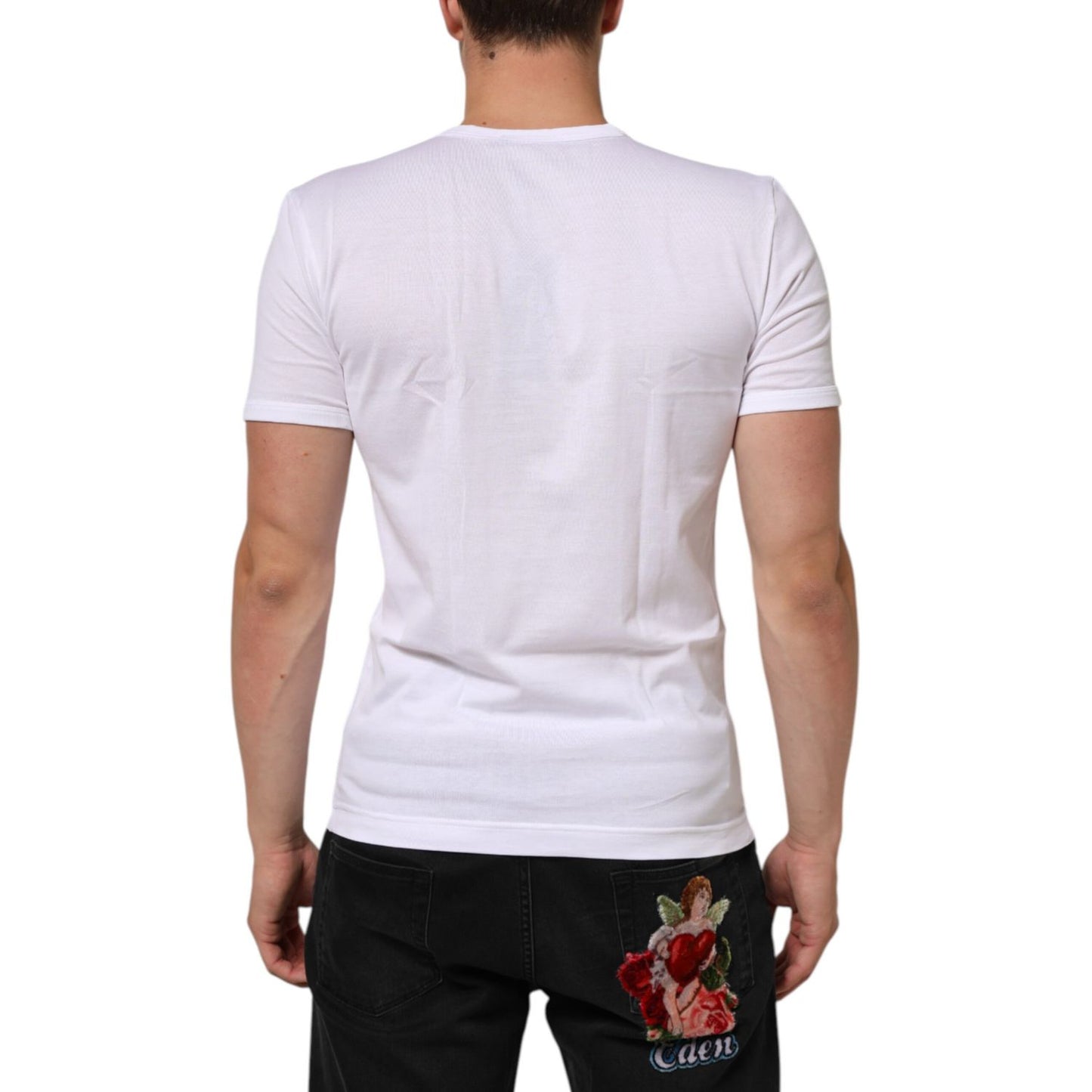 Back view of a model wearing a Dolce & Gabbana White Cotton V-Neck Short Sleeves T-shirt, emphasizing its fit and design.