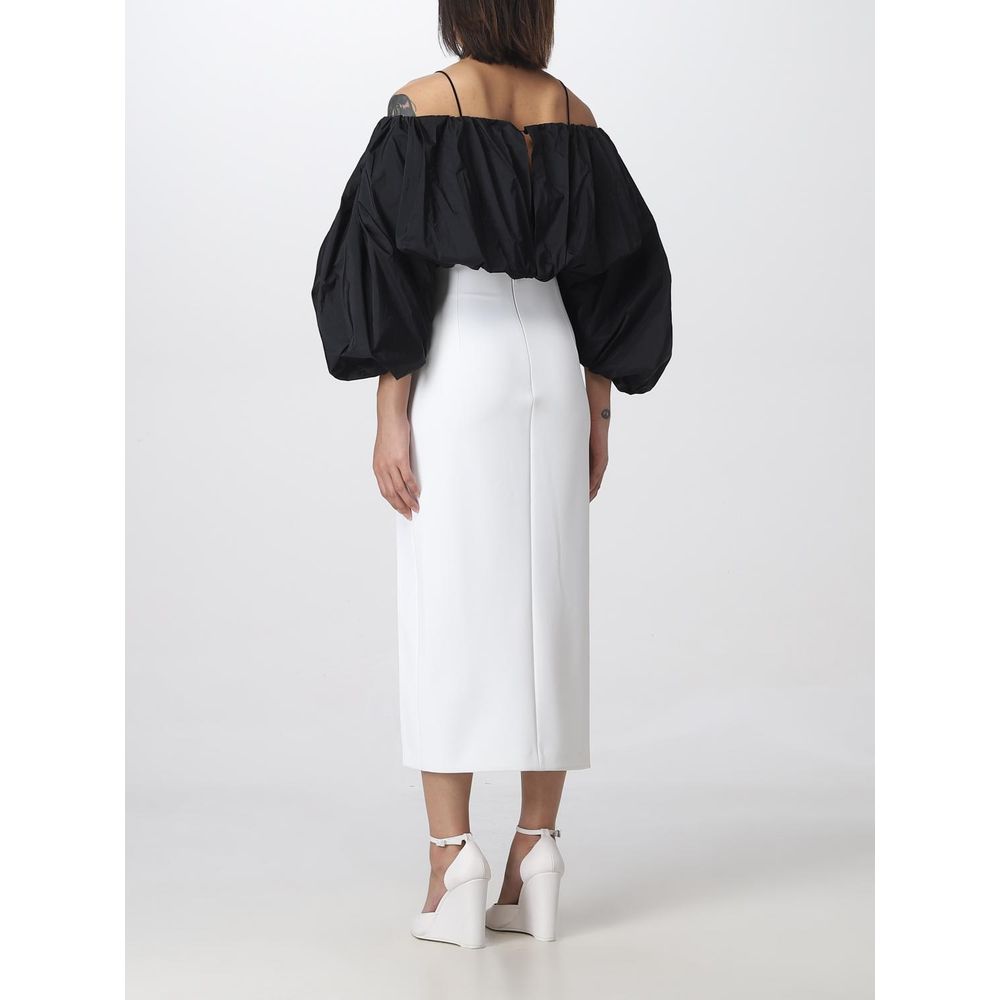 Back view of a model wearing a PINKO White Polyester Midi Skirt with stylish thigh slit, showcasing a chic and elegant look.