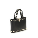 Valentino Garavani Mini Shopping Rockstud in black leather with platinum-finish studs, detachable chain, and dual carrying options.