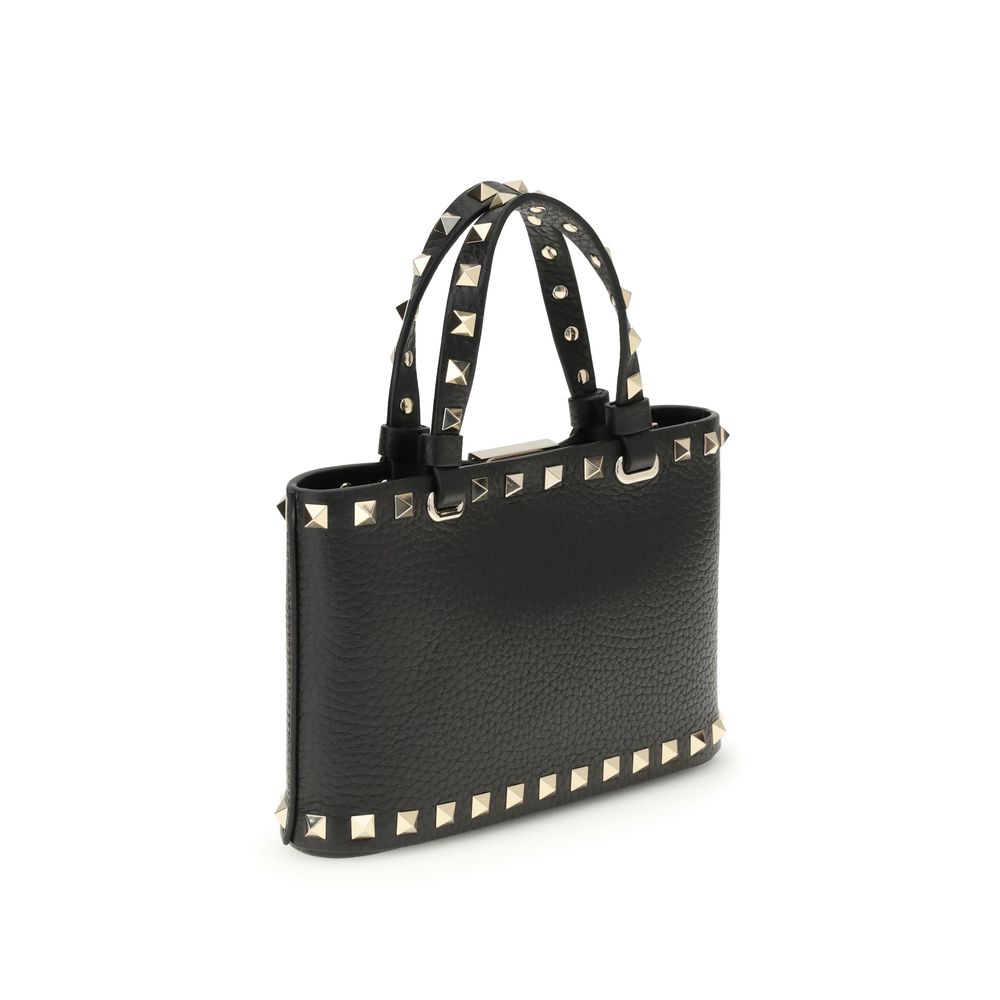 Valentino Garavani Mini Shopping Rockstud bag in black calfskin with platinum-finish studs and removable chain strap.
