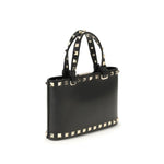 Valentino Garavani Mini Shopping Rockstud bag in black calfskin with platinum-finish studs and removable chain strap.