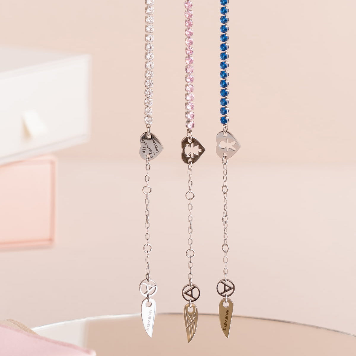 AN JEWELS JEWELRY Mod. AL.BLIYMBL stylish necklaces with silver pendants and colorful chains displayed elegantly.