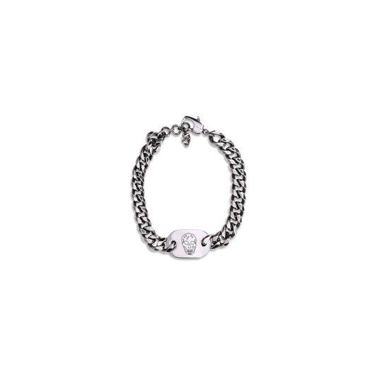 Alt Tag: Alexander McQueen Silver Brass Bracelet with skull charm and antiqued finish on white background.