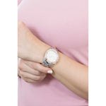 Lady wearing BREIL Mod. C watch with quartz movement and 36mm case, showcasing elegance and style. Water resistant 5 ATM, mineral dial.