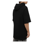 Back view of Balmain Black Cotton Sweater with side logo print, drawstring hood, and half-sleeve design