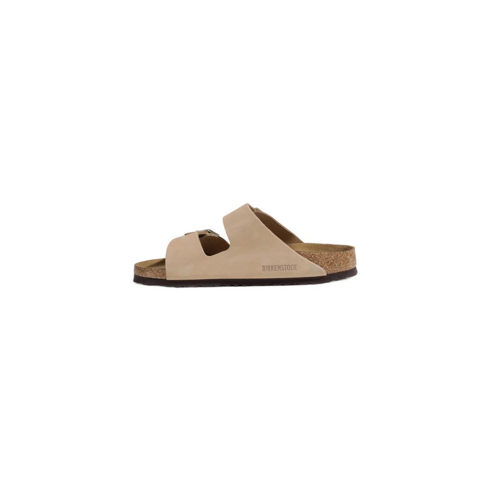 Birkenstock Beige Nubuc Leather Slippers with adjustable straps and cork footbed, side view.