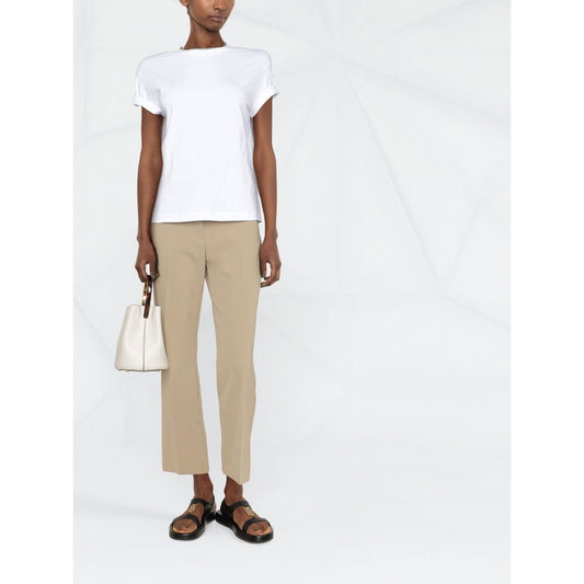 Brunello Cucinelli Chain-trim round-neck t-shirt in white with short sleeves, styled with beige pants, perfect for casual elegance.